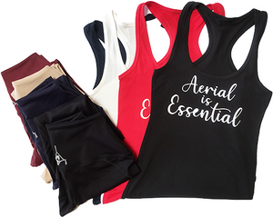 Aerial is Essentials racerback tanks shown with leggings